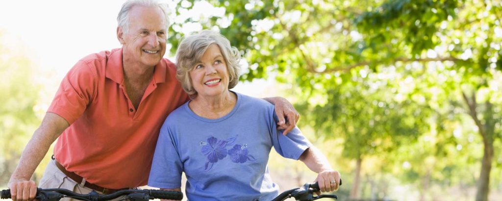 Senior Couple On Bicycles 1500x600